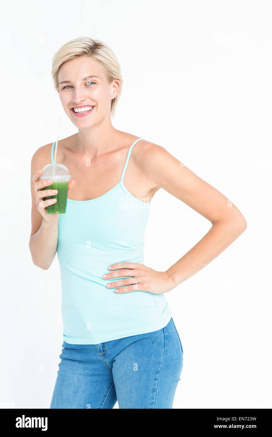 Beautiful woman holding green juice Stock Photo
