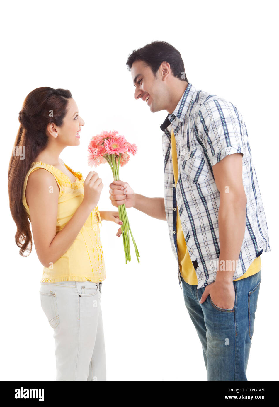 Man giving flowers to woman Stock Photo