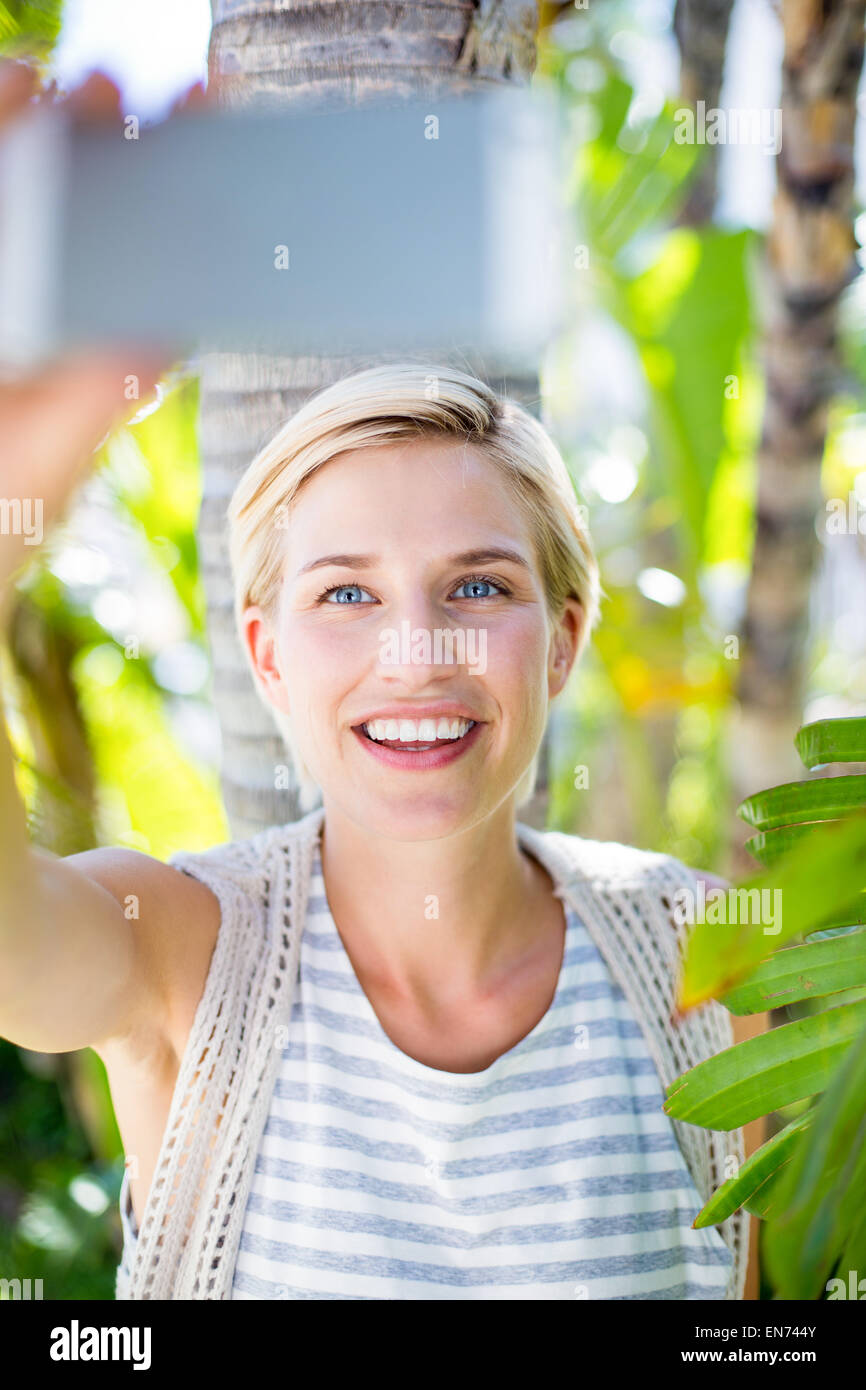Pretty blonde woman taking selfie Stock Photo - Alamy