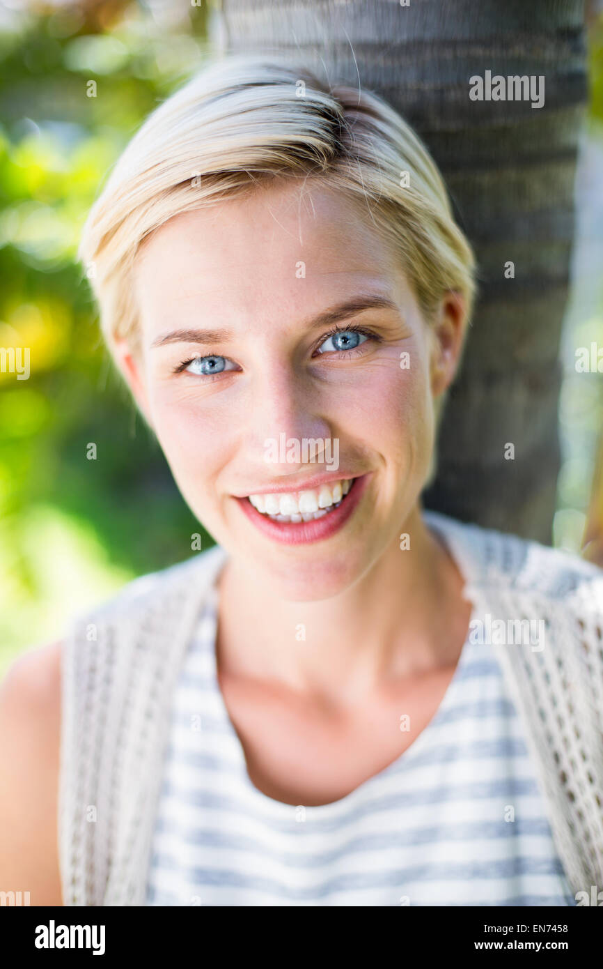 Pretty blonde woman smiling at the camera Stock Photo - Alamy