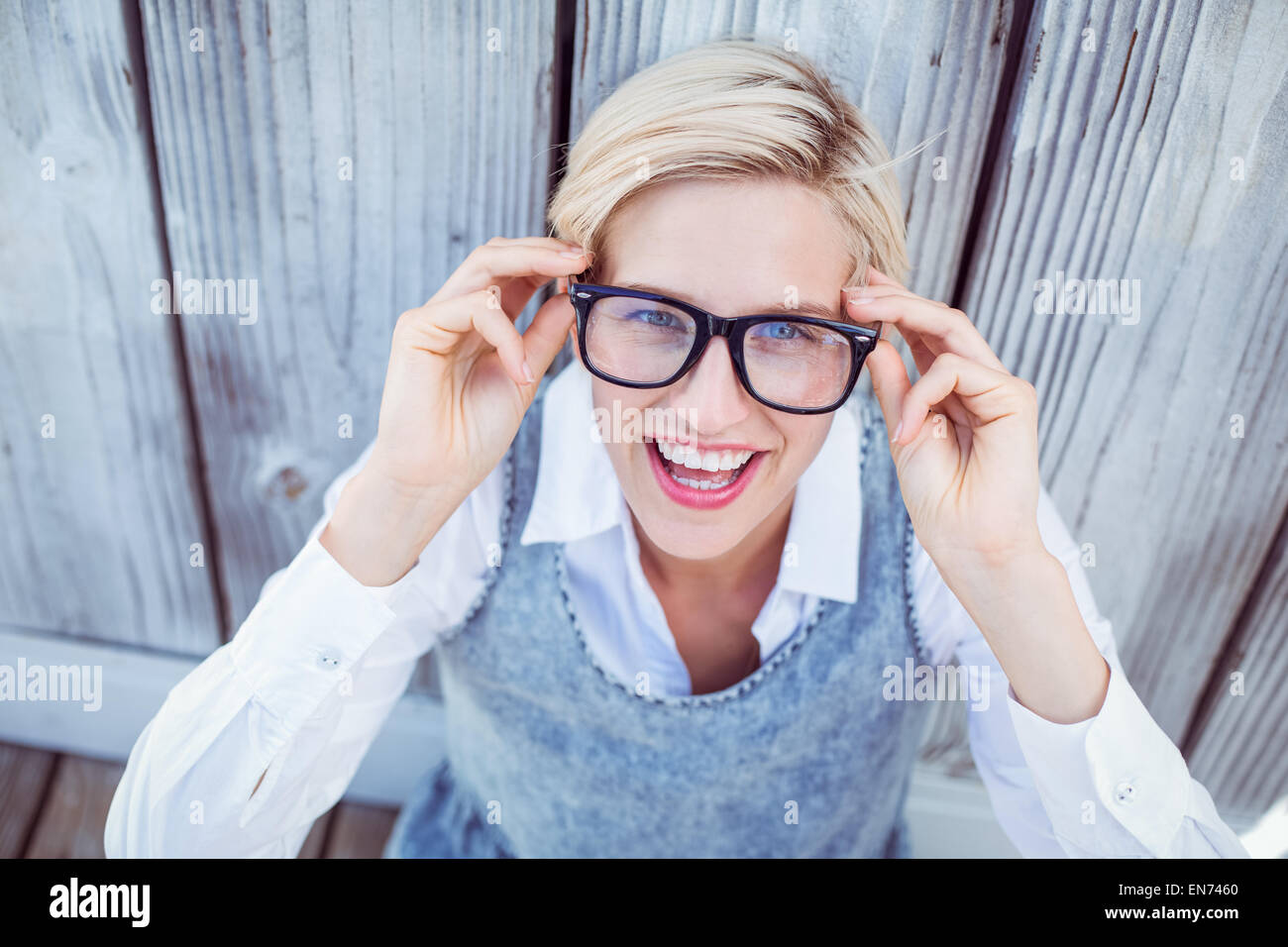 Pretty blonde woman smiling at the camera Stock Photo - Alamy