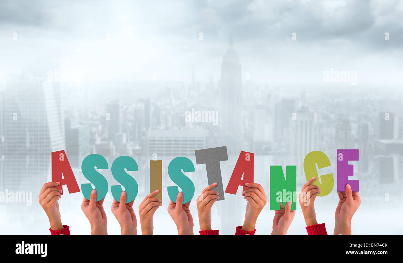 Composite image of hands holding up assistance Stock Photo