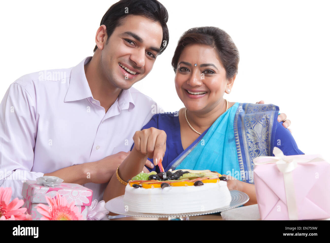 Portrait of mother and son with birthday cake Stock Photo