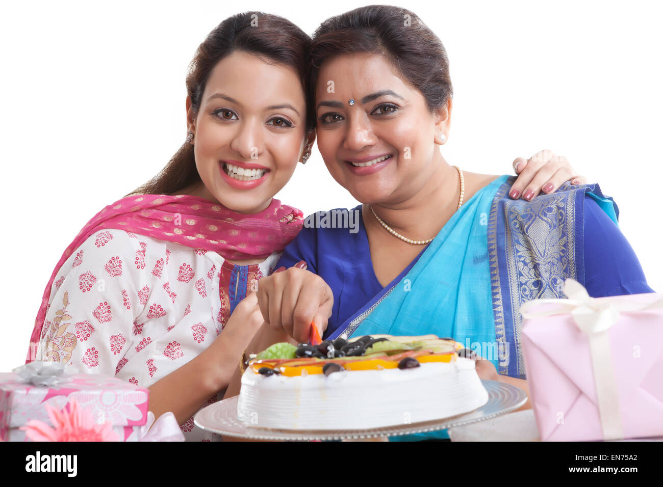 Portrait of mother and daughter with birthday cake Stock Photo