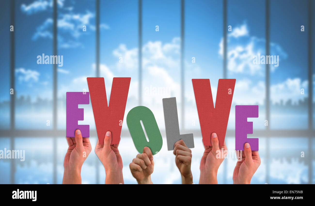Composite image of hands holding up evolve Stock Photo