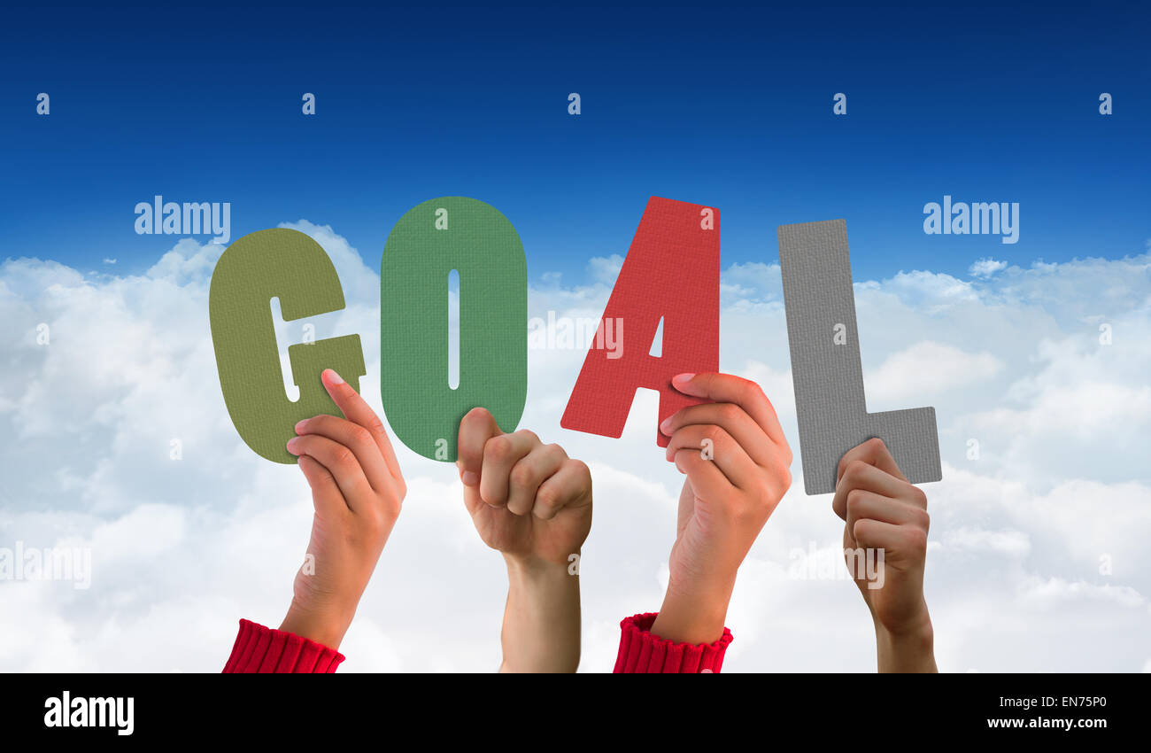 Composite image of hands showing goal Stock Photo Alamy