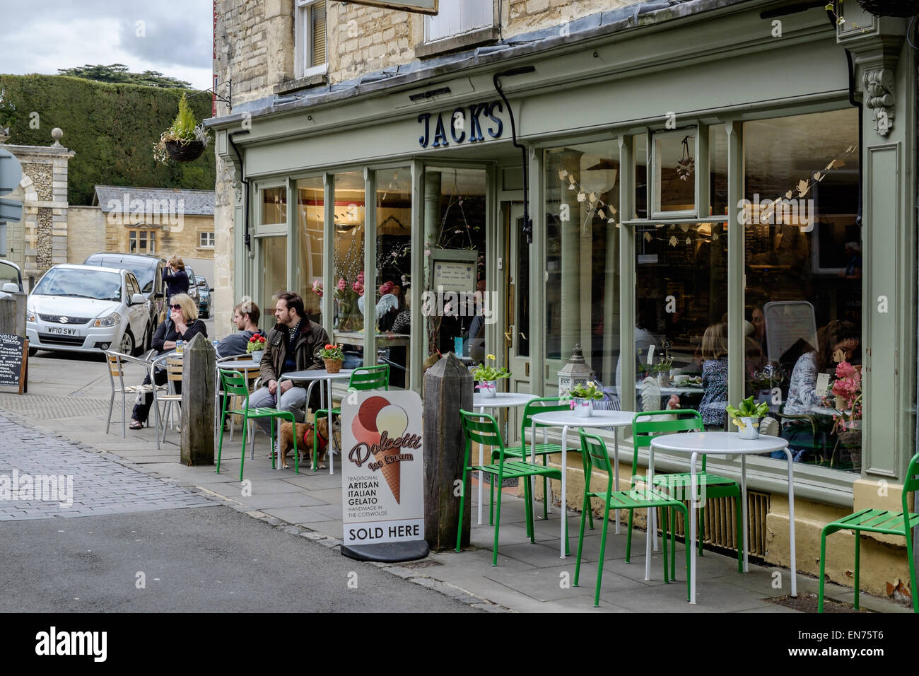 A street scene outside Jack's Coffee House in Cirencester, Gloucestershire, UK. There are customers, tables and chairs outside Stock Photo