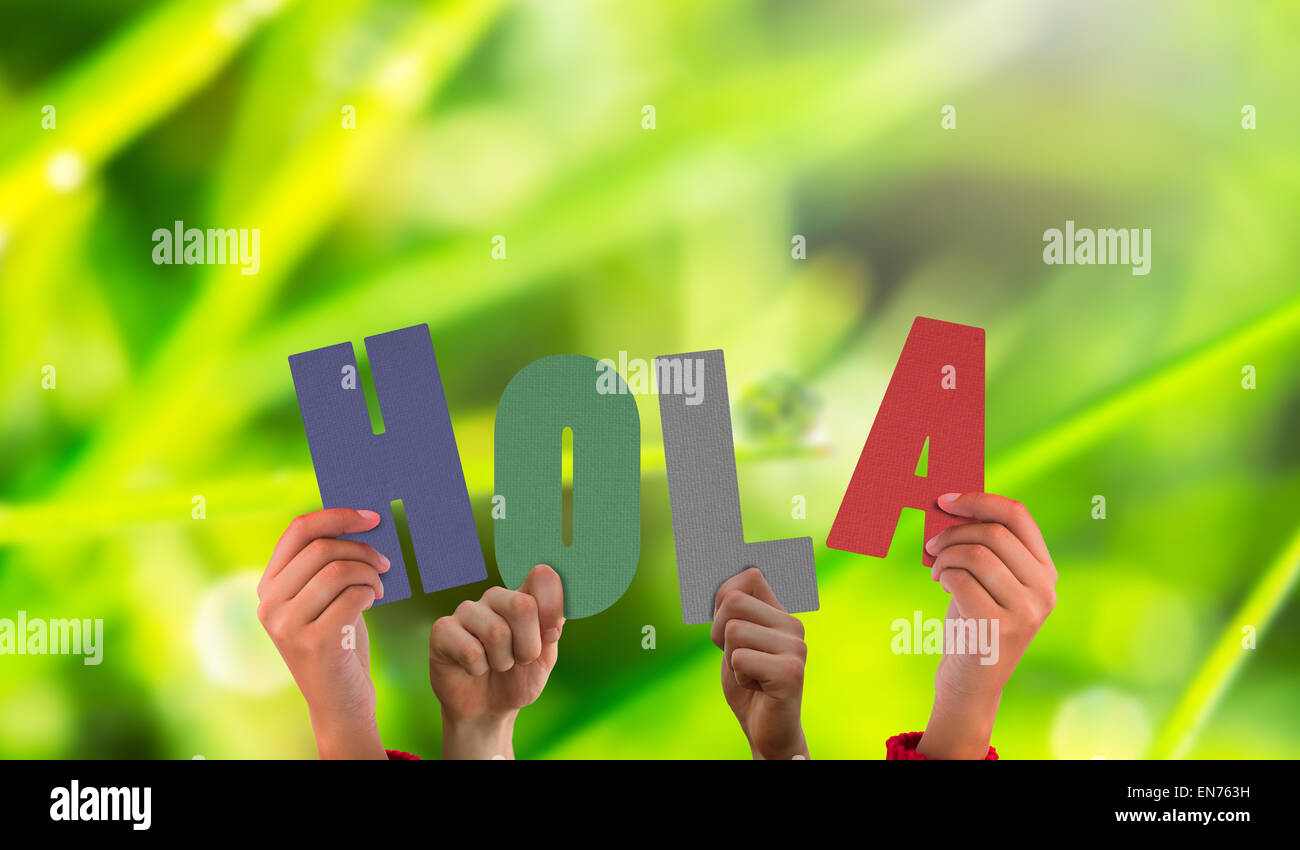 Composite image of hands holding up hola Stock Photo