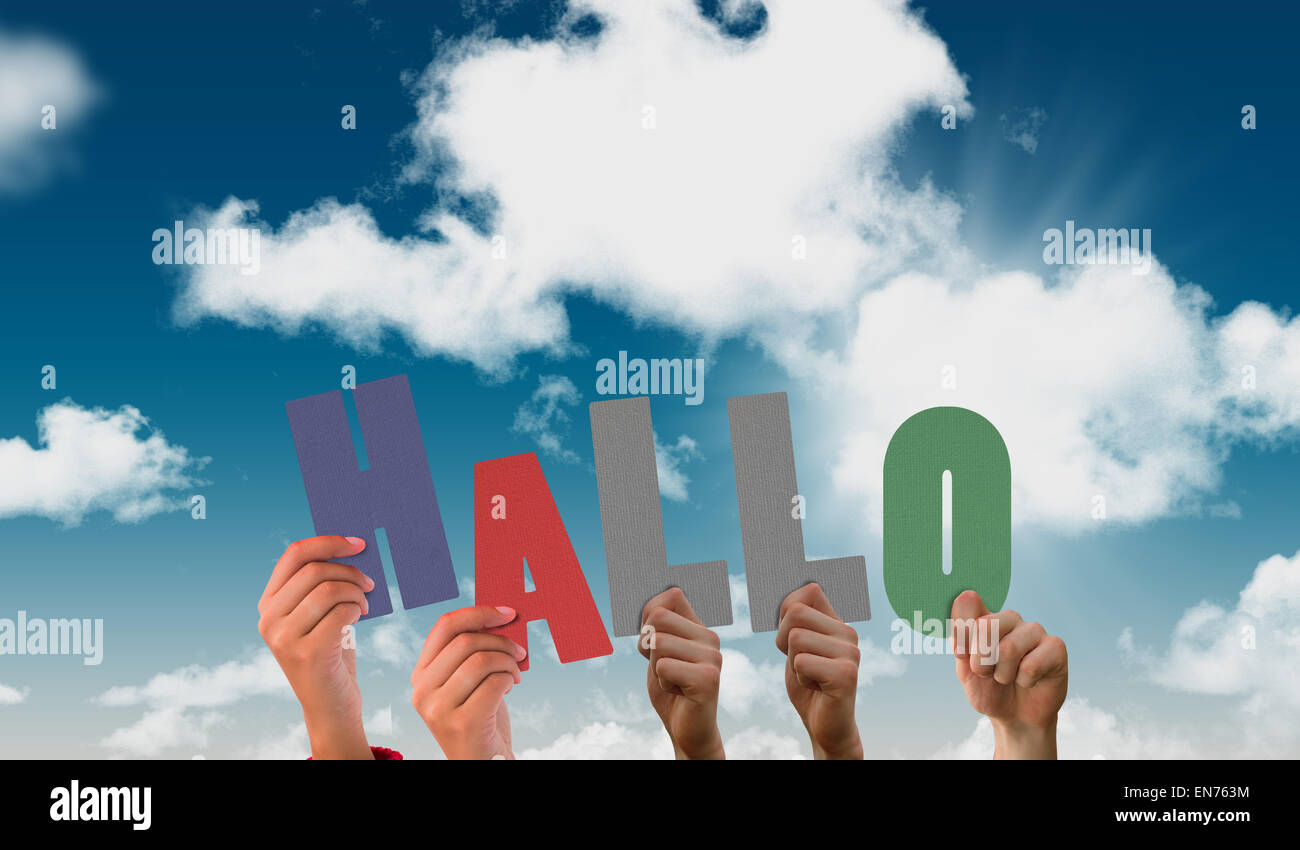 Composite image of hands holding up hallo Stock Photo