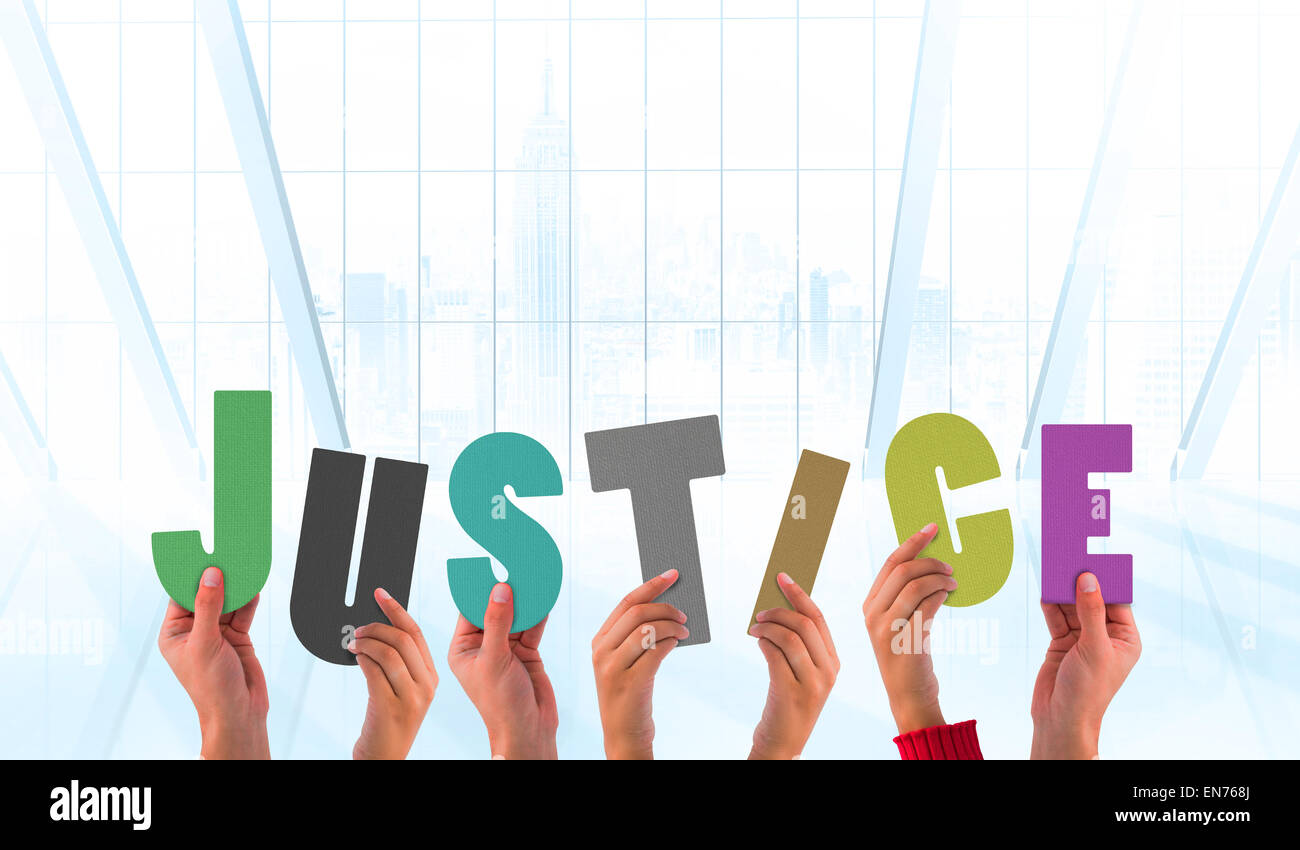 Composite image of hands holding up justice Stock Photo