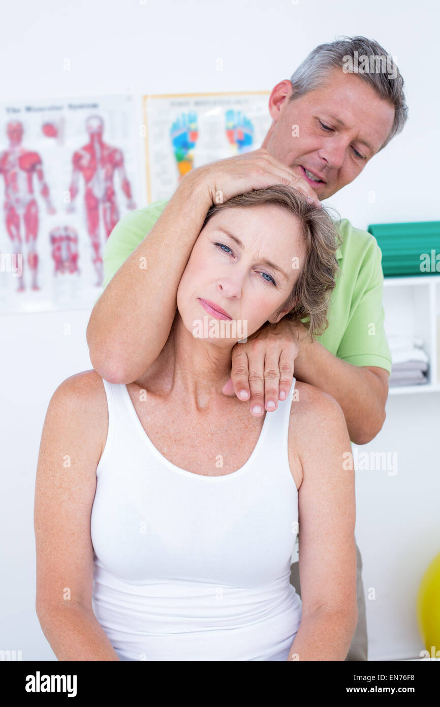 Doctor doing neck adjustment Stock Photo Alamy