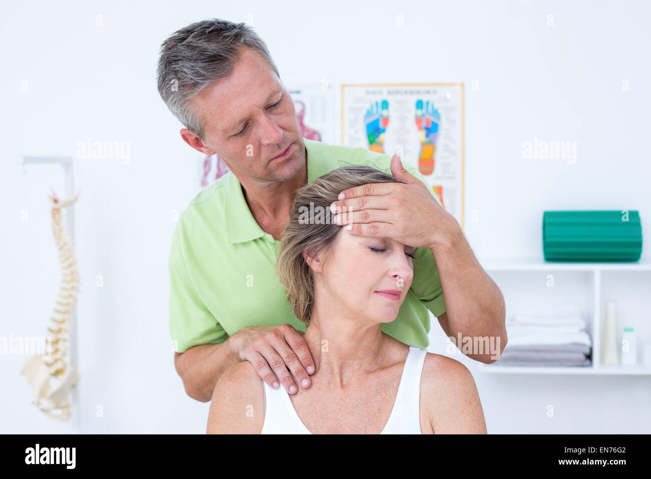 Doctor doing neck adjustment Stock Photo Alamy