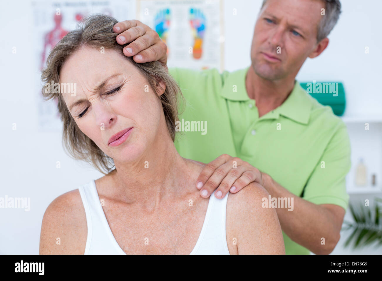 Doctor doing neck adjustment Stock Photo Alamy