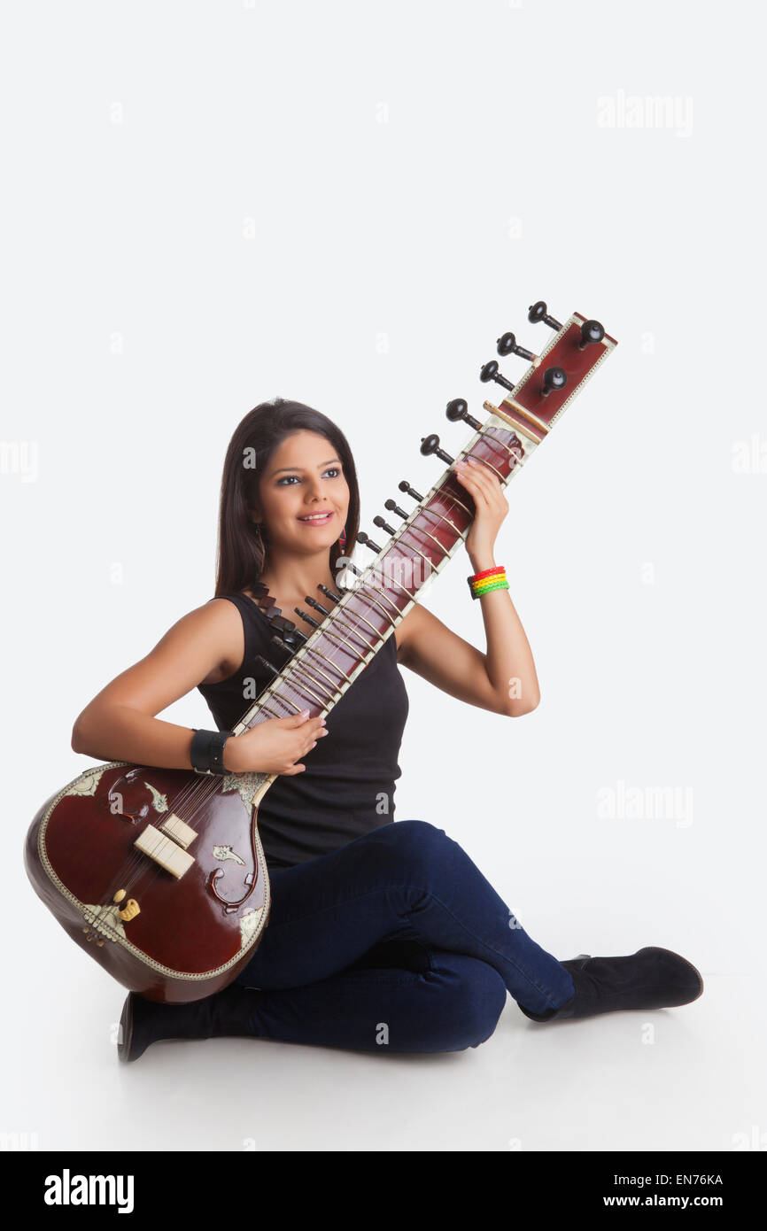 Young woman playing the sitar Stock Photo Alamy