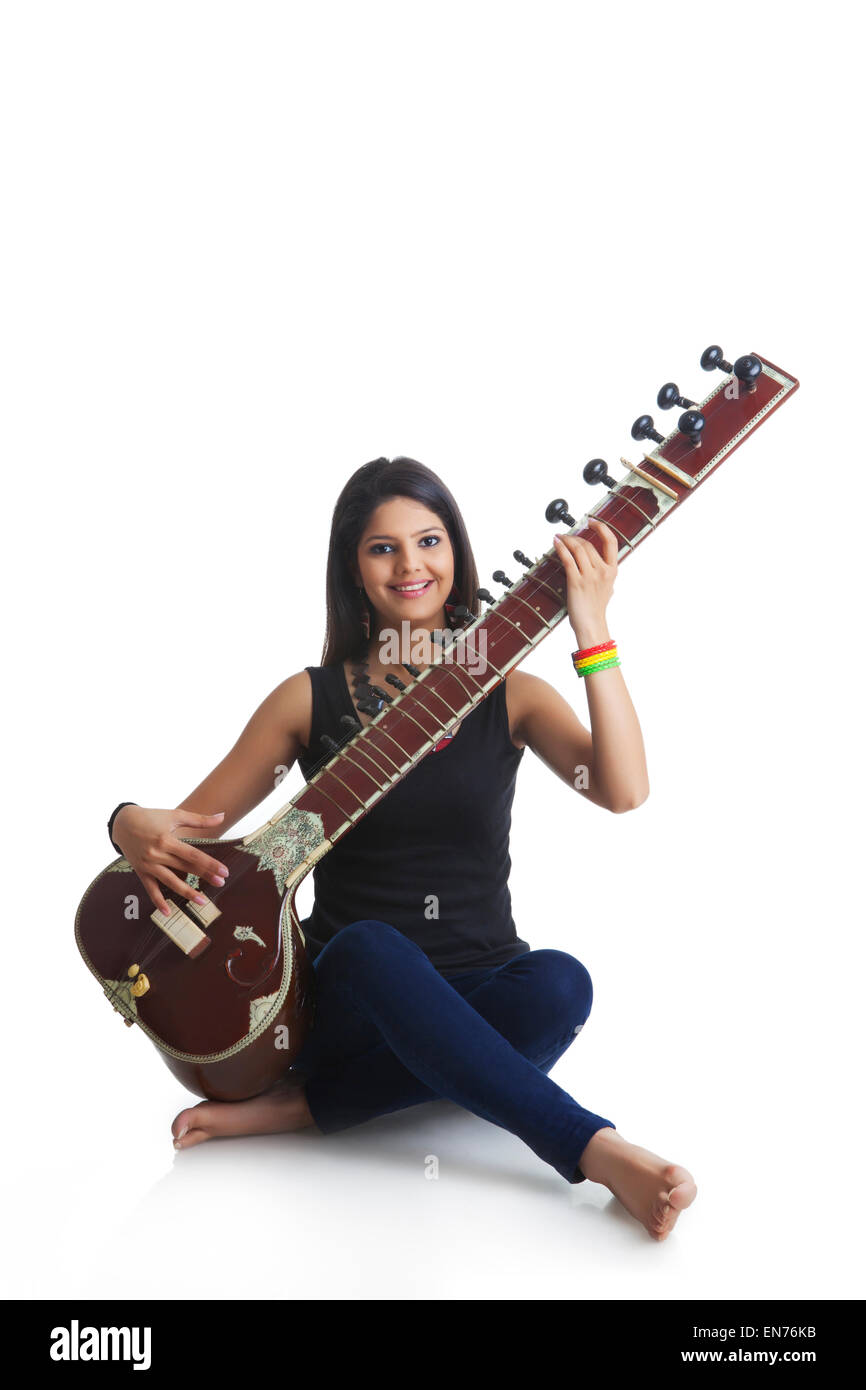 Young woman playing the sitar Stock Photo