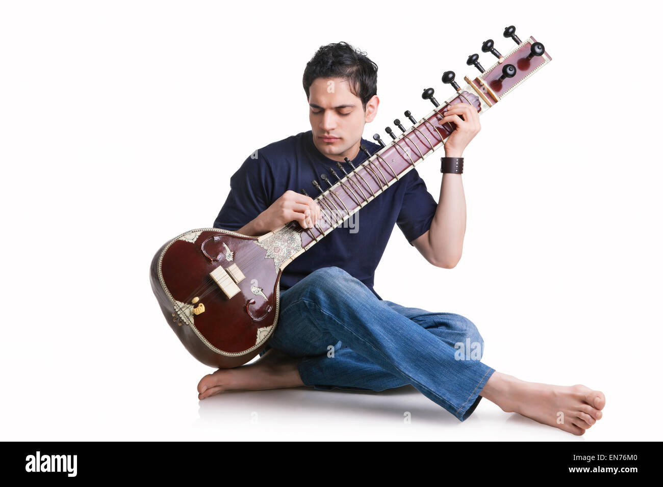 Young man playing the sitar Stock Photo Alamy