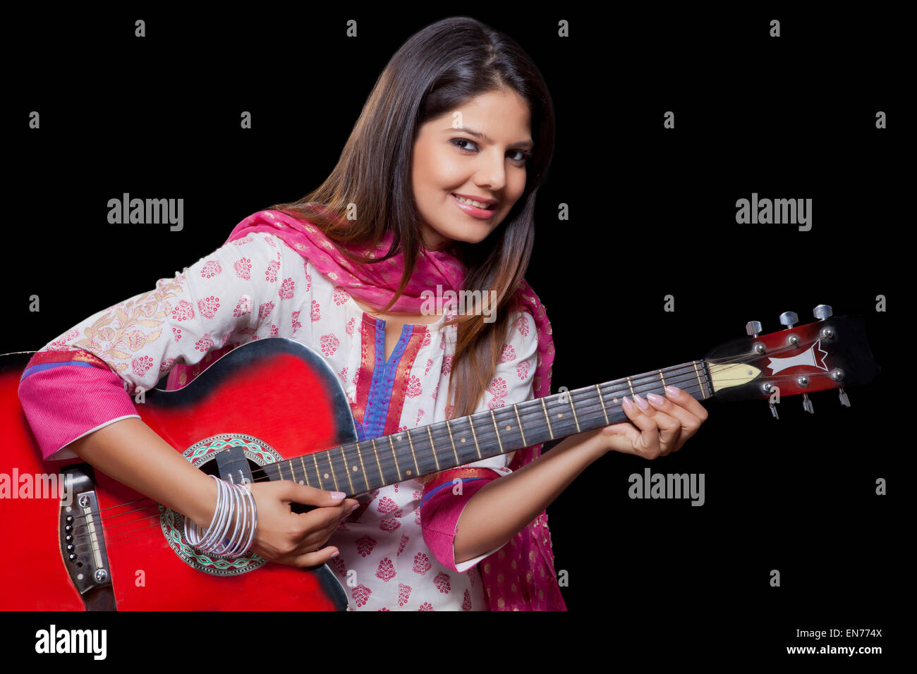 Young woman playing the guitar Stock Photo - Alamy