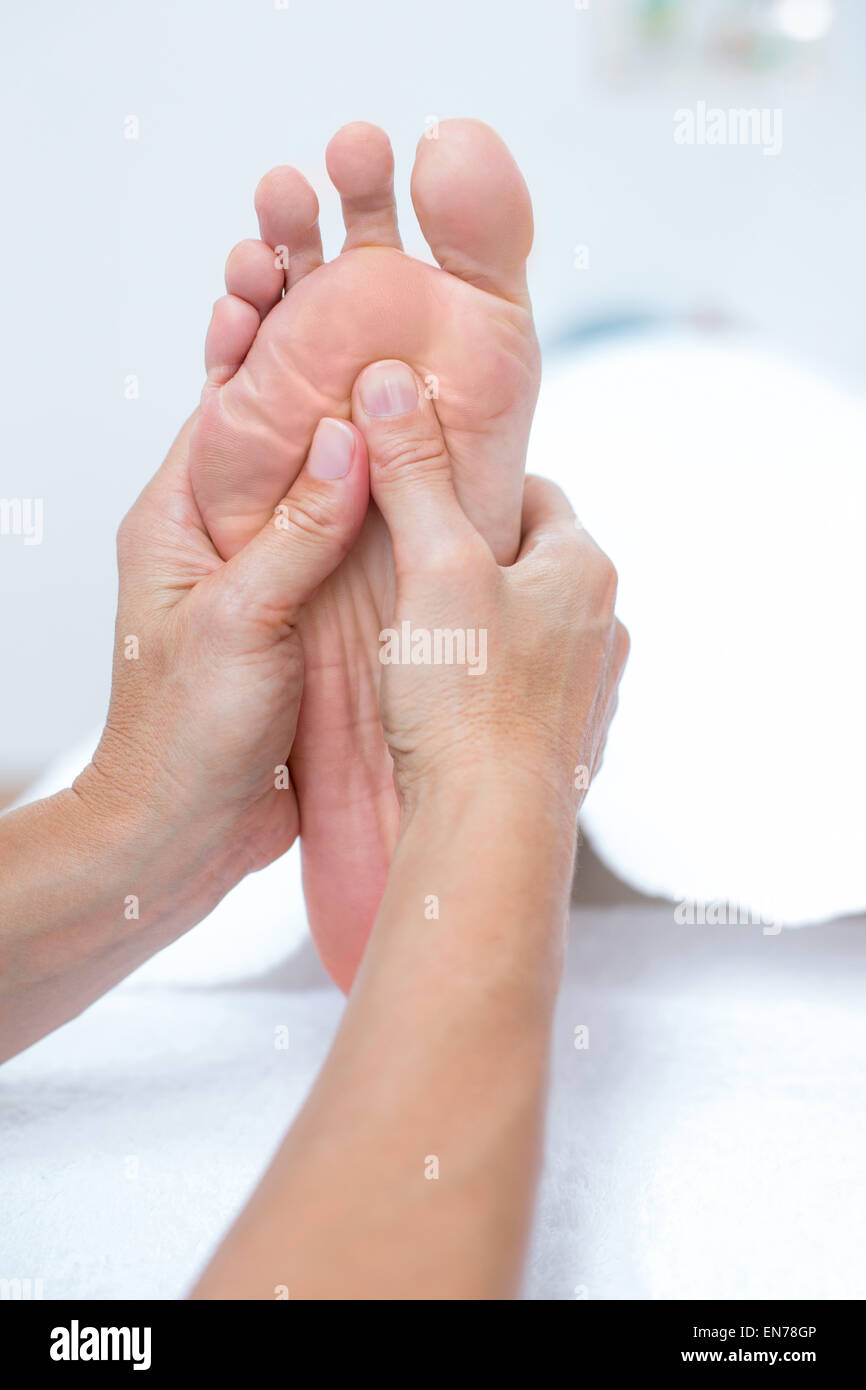 Physiotherapist doing foot massage Stock Photo