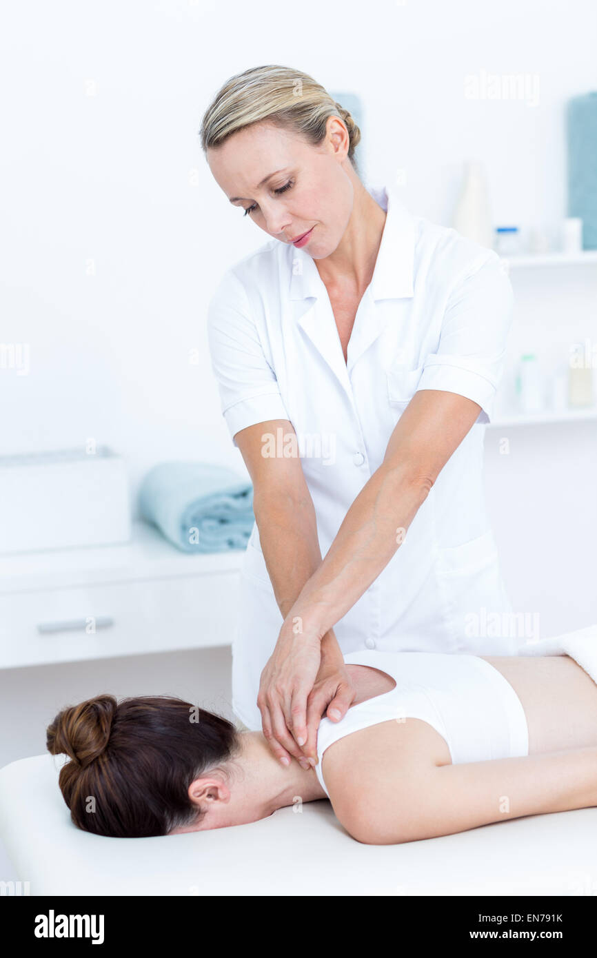Physiotherapist doing shoulder massage Stock Photo