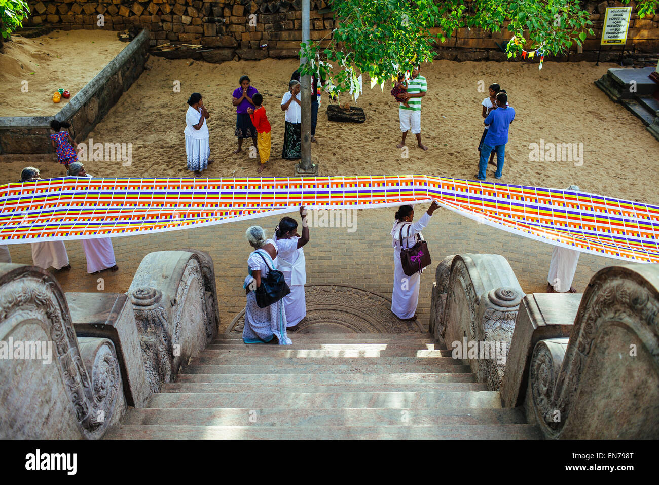 Pilgrims bring offerings to Sri Maha Bodhi in Anuradhapura, Sri Lanka. Stock Photo
