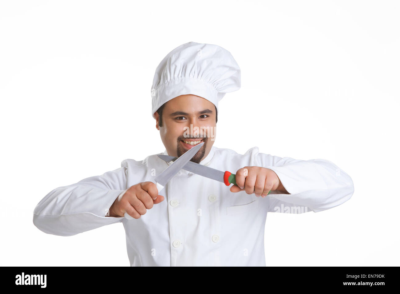Portrait of chef sharpening knives Stock Photo