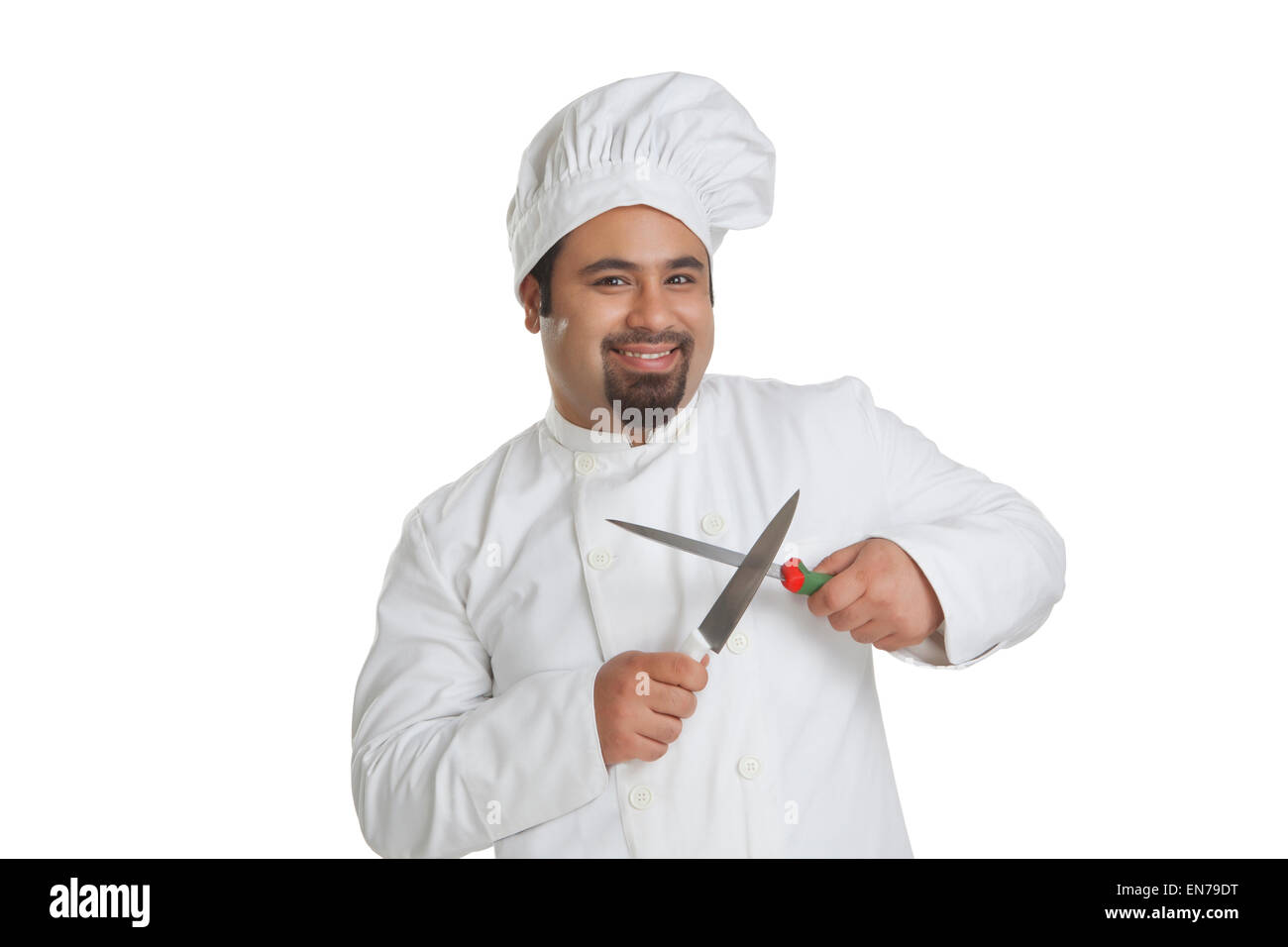 Portrait of chef sharpening knives Stock Photo