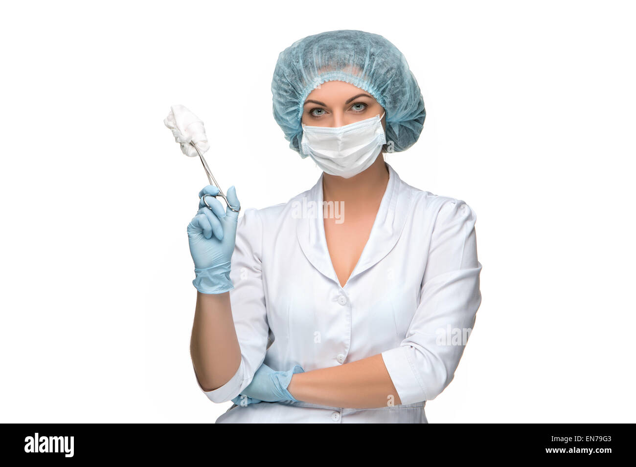 Portrait of lady surgeon holding surgical instrument over white background Stock Photo