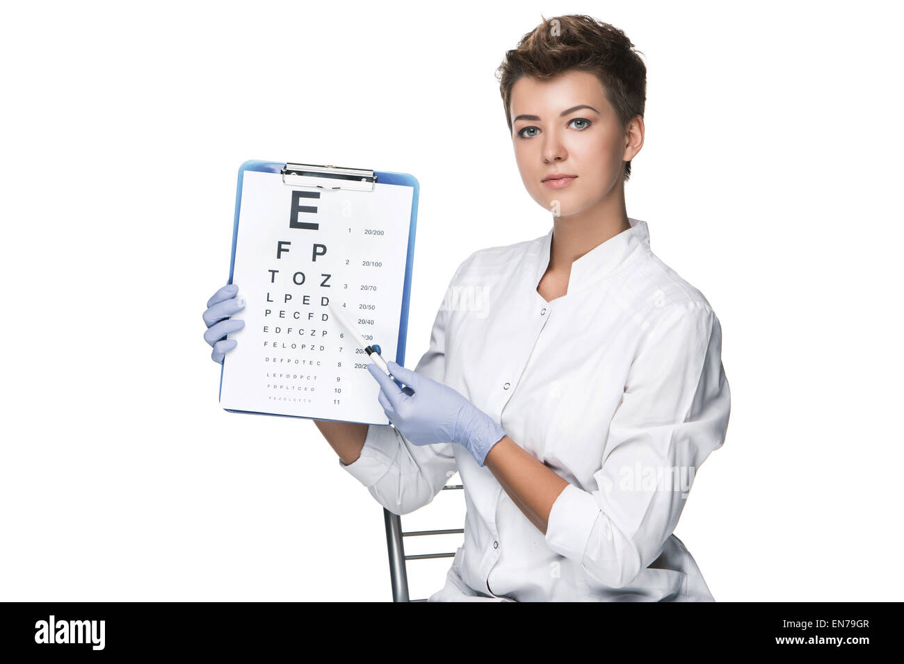 young woman ophthalmologist with eye chart Stock Photo