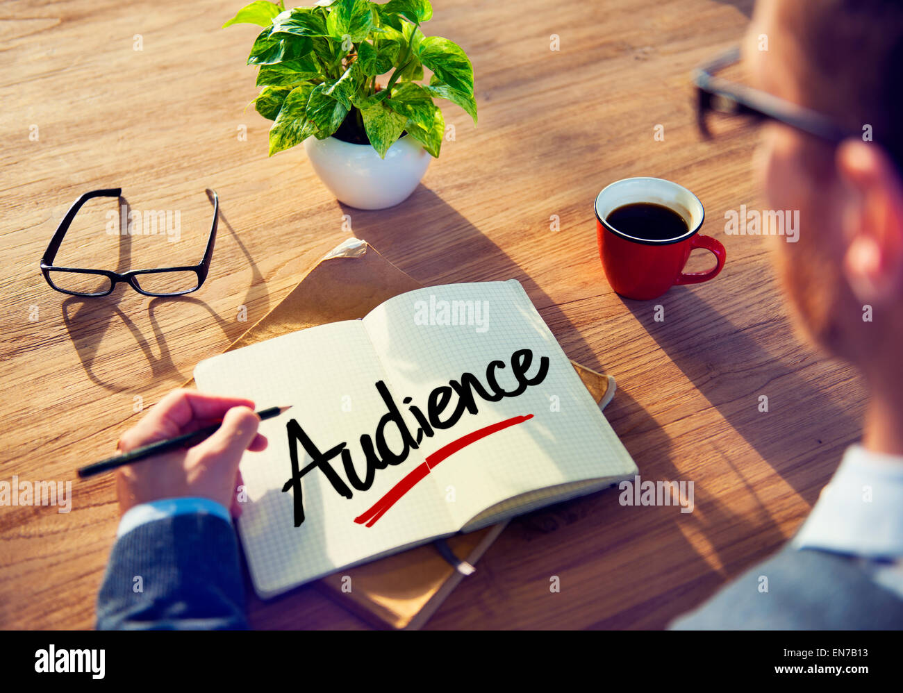 Businessman Writing the Word "Audience Stock Photo Alamy