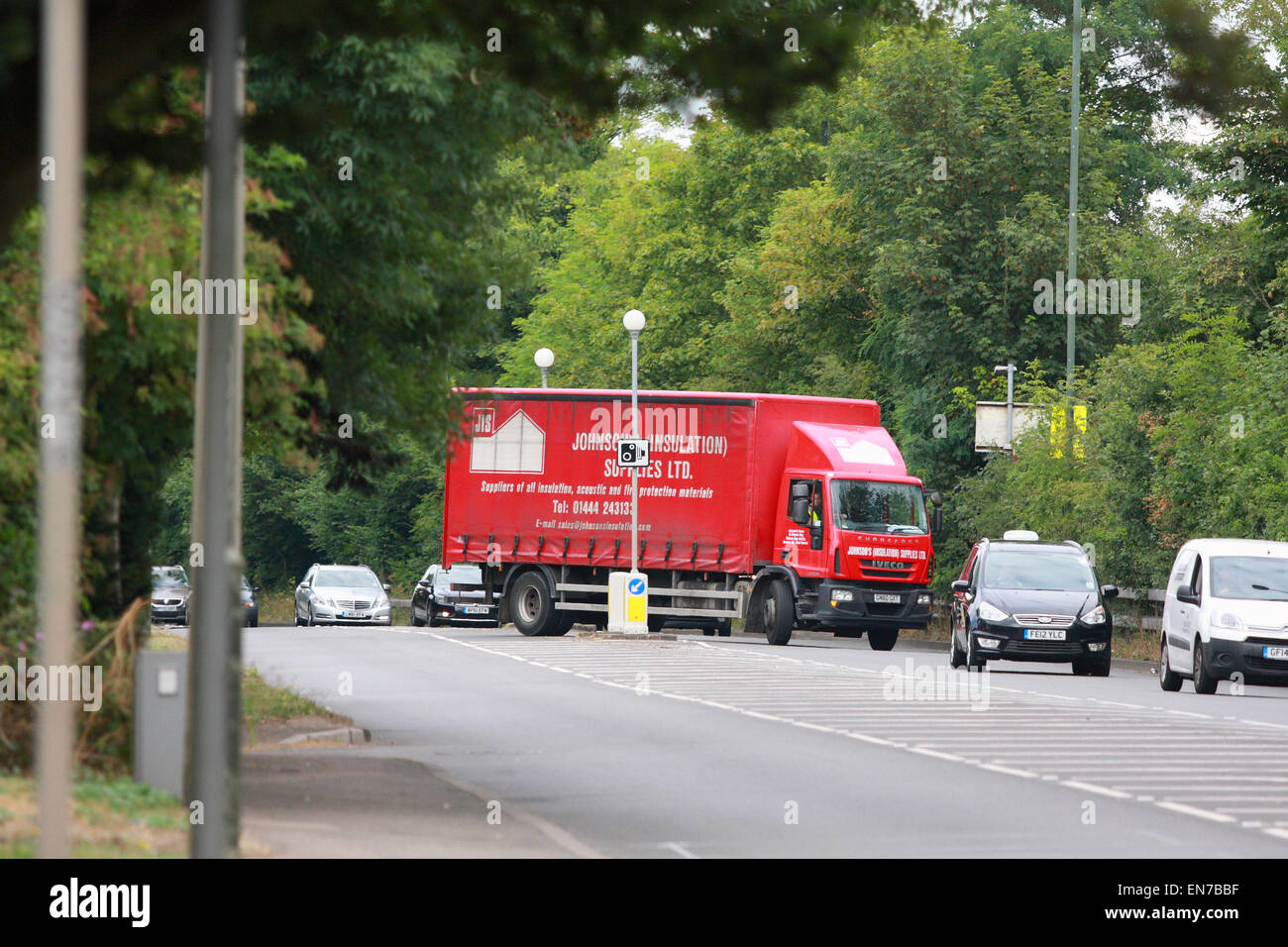 A truck turning right into traffic traveling along the A23 road in Coulsdon, Surrey, England. Stock Photo