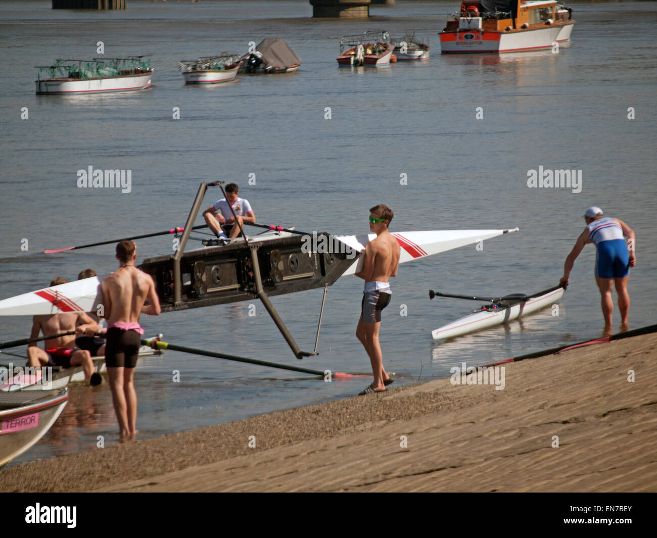 Rowing club members by the River Thames on the Putney Embankment in