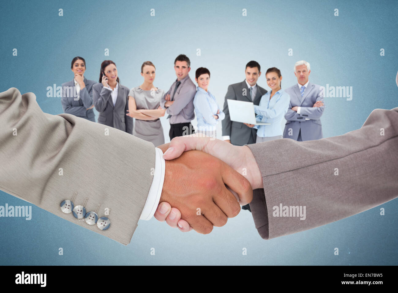 Composite image of side view of shaking hands Stock Photo