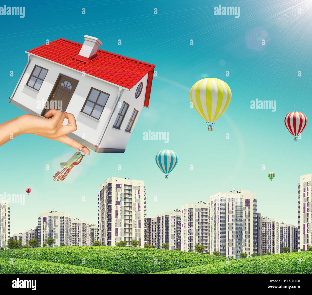 House and keys in businesswomans hand on cityscape Stock Photo - Alamy