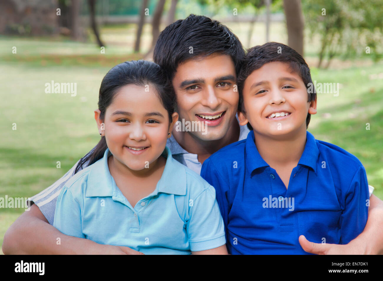 Portrait of family in park Stock Photo - Alamy