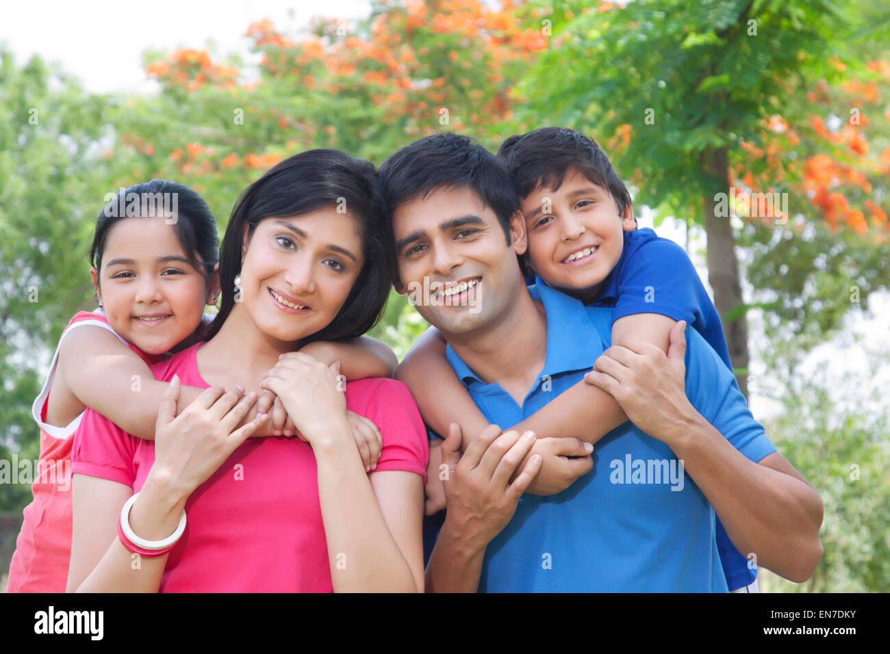 Portrait of family in park Stock Photo - Alamy