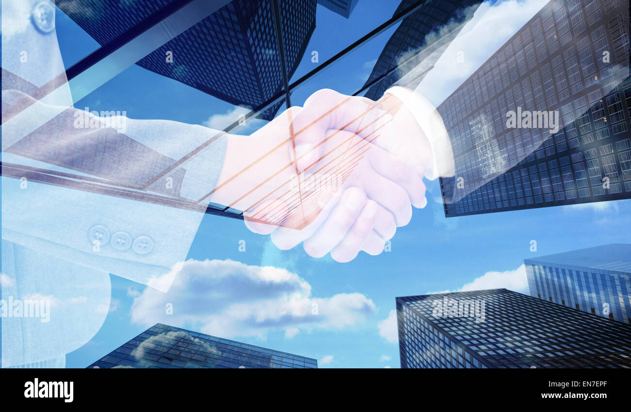 Composite image of handshake between two business people Stock Photo ...