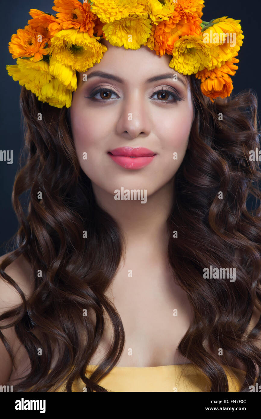 Portrait of a beautiful woman with flowers in her hair Stock Photo - Alamy