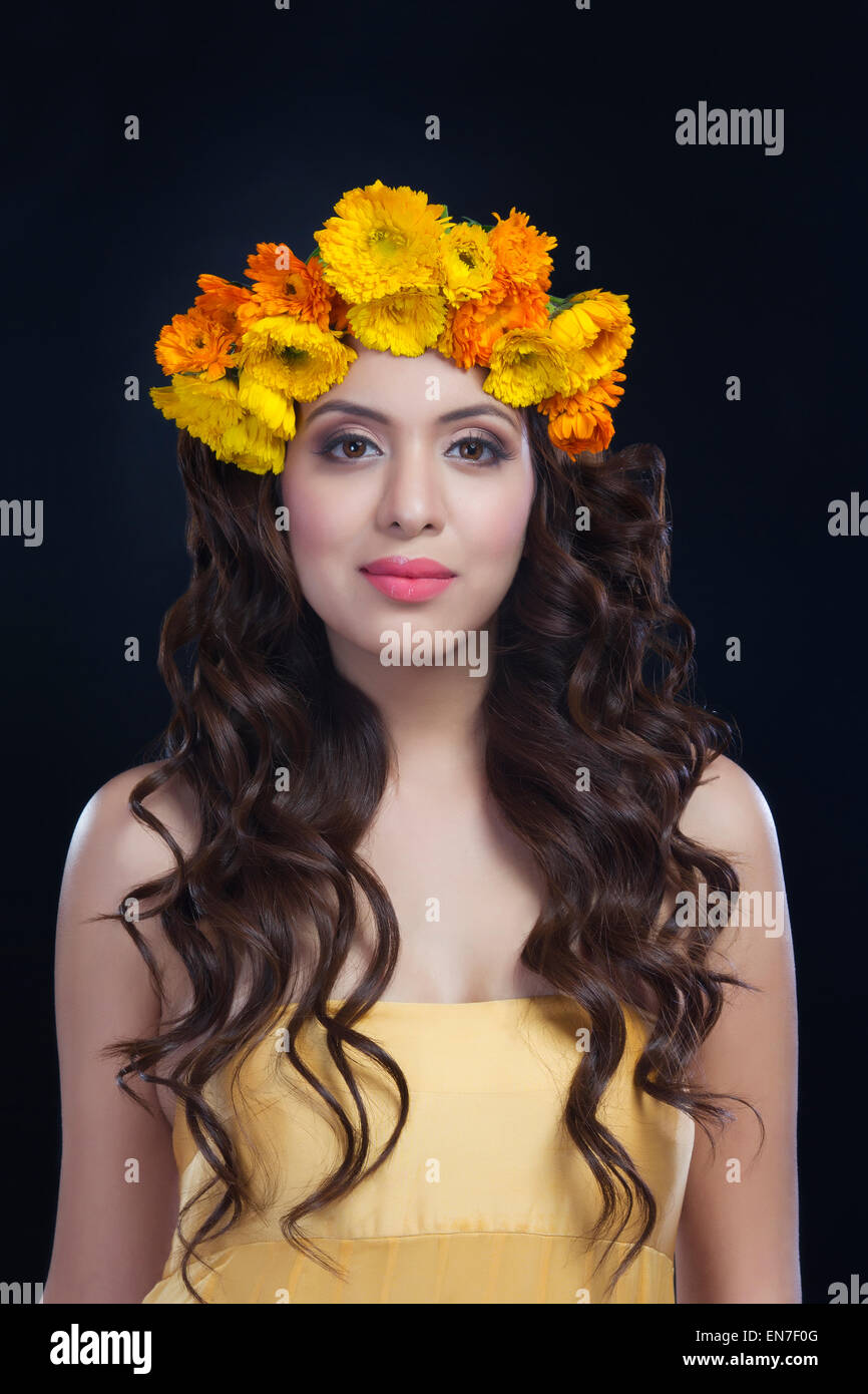 Portrait of a beautiful woman with flowers in her hair Stock Photo - Alamy