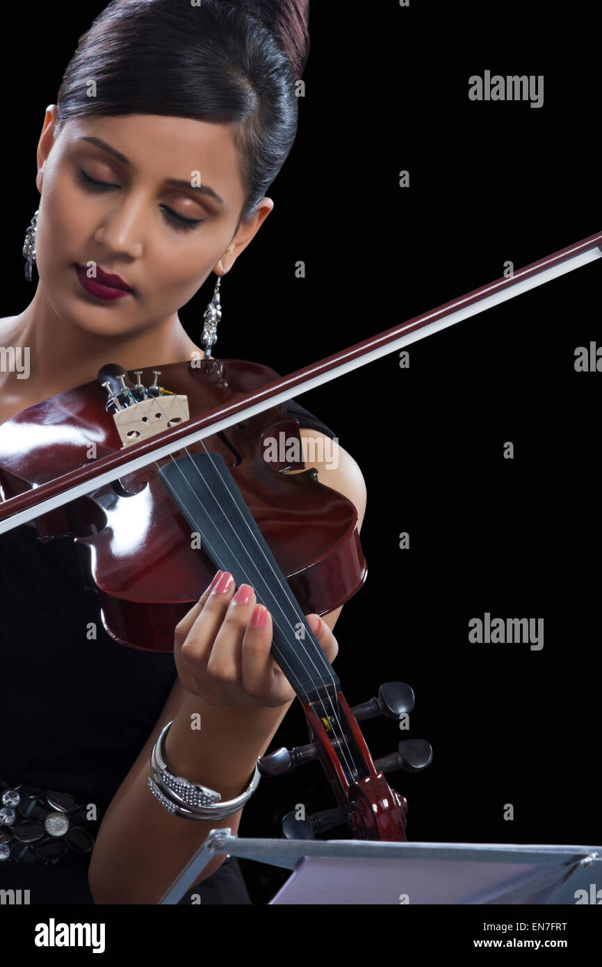Young woman playing a violin hi-res stock photography and images - Alamy