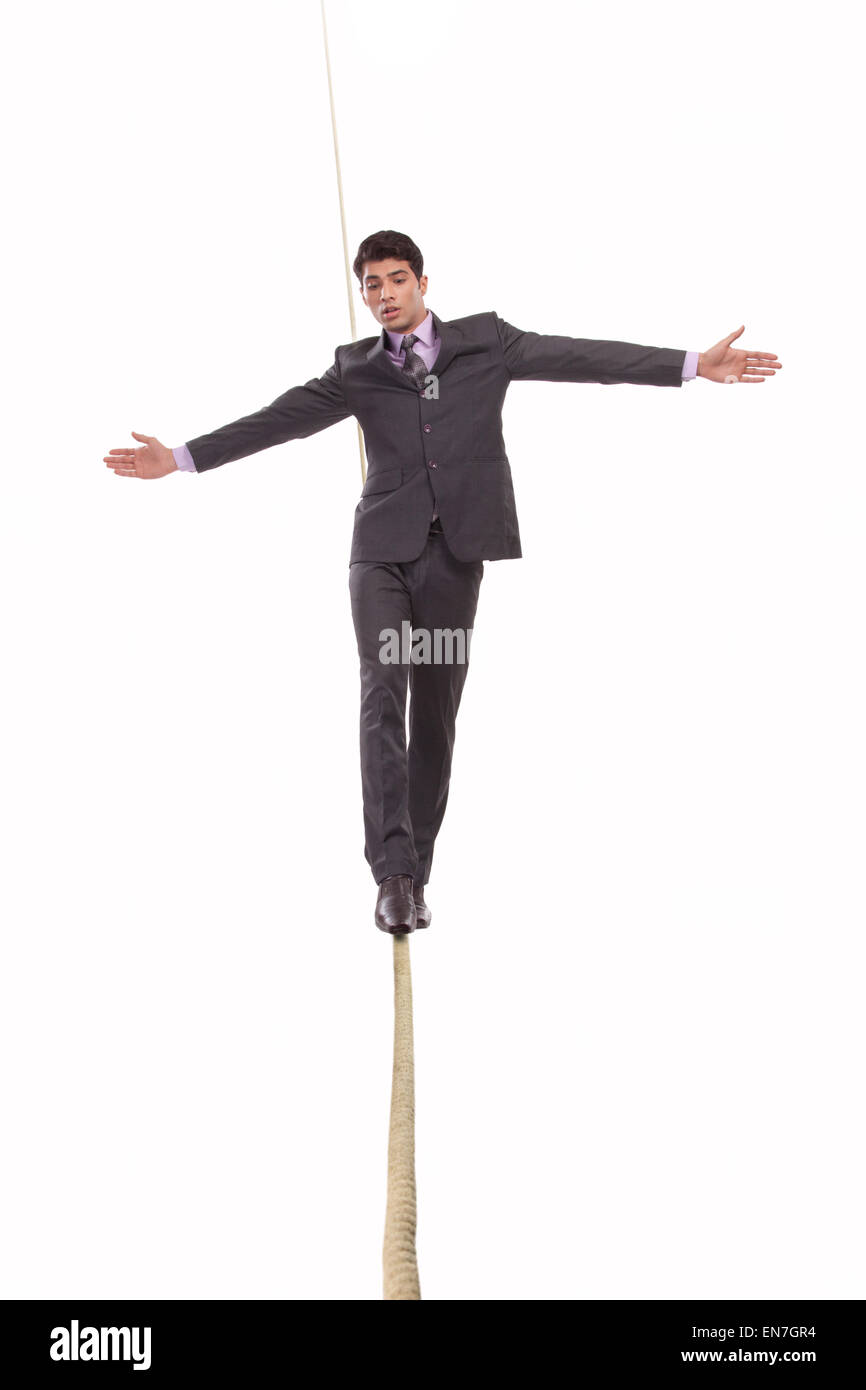 Man balancing on rope hi-res stock photography and images - Alamy