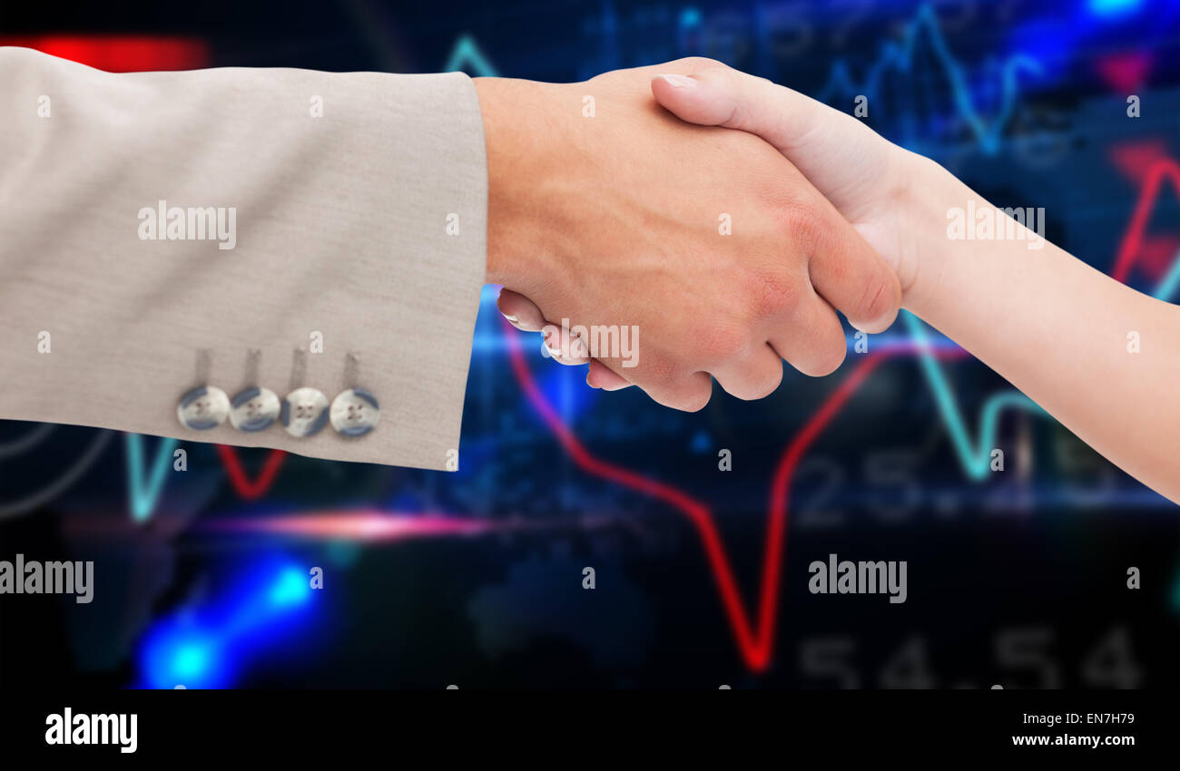 Composite image of close up of female and male hand shaking Stock Photo