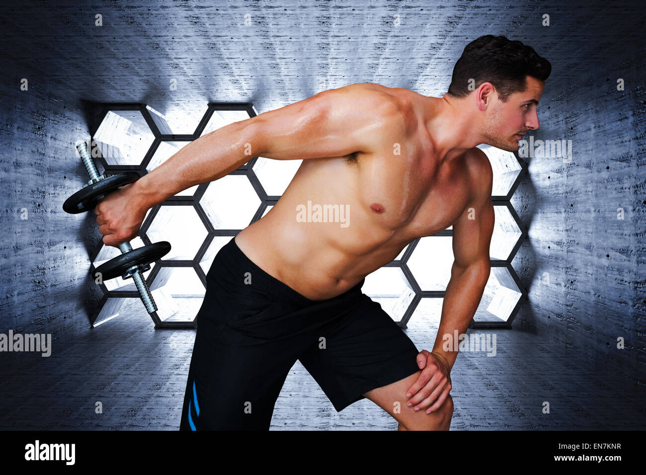 Composite image of bodybuilder lifting dumbbell Stock Photo