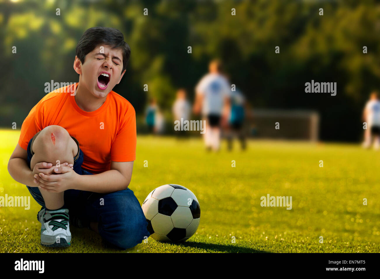 Boy crying out in pain Stock Photo Alamy