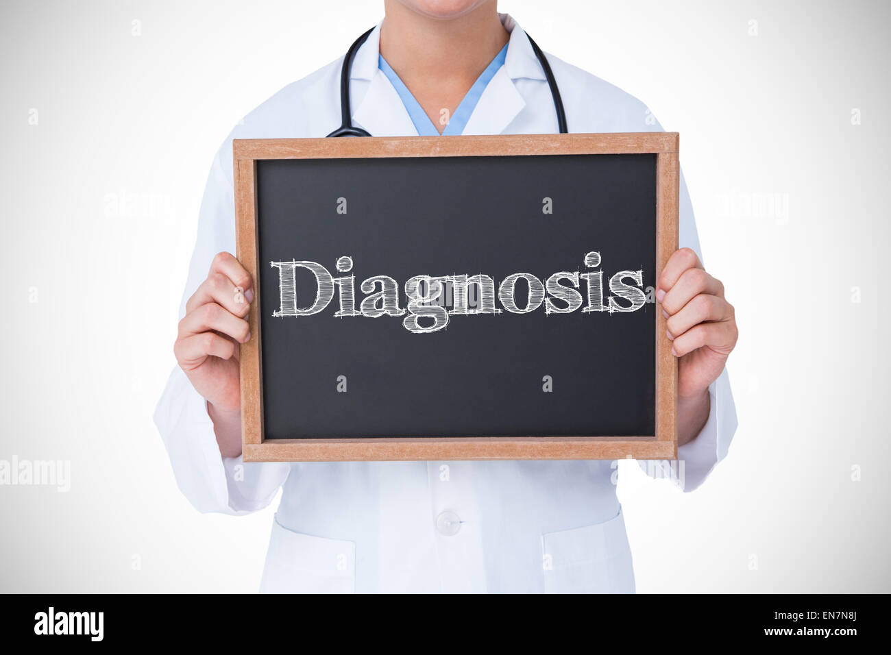 Diagnosis against doctor showing little blackboard Stock Photo