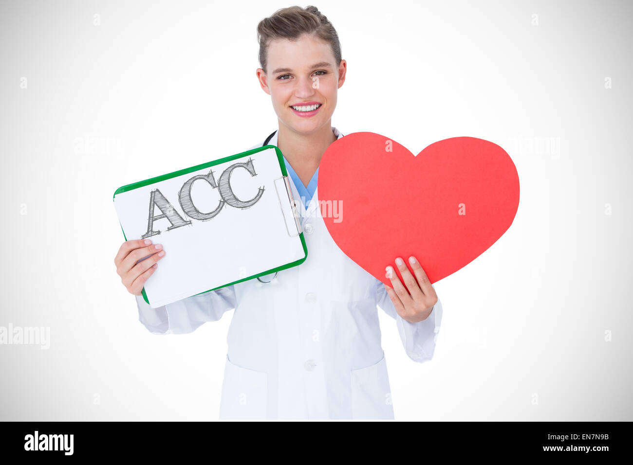 Acc against happy doctor holding clipboard and heart card Stock Photo