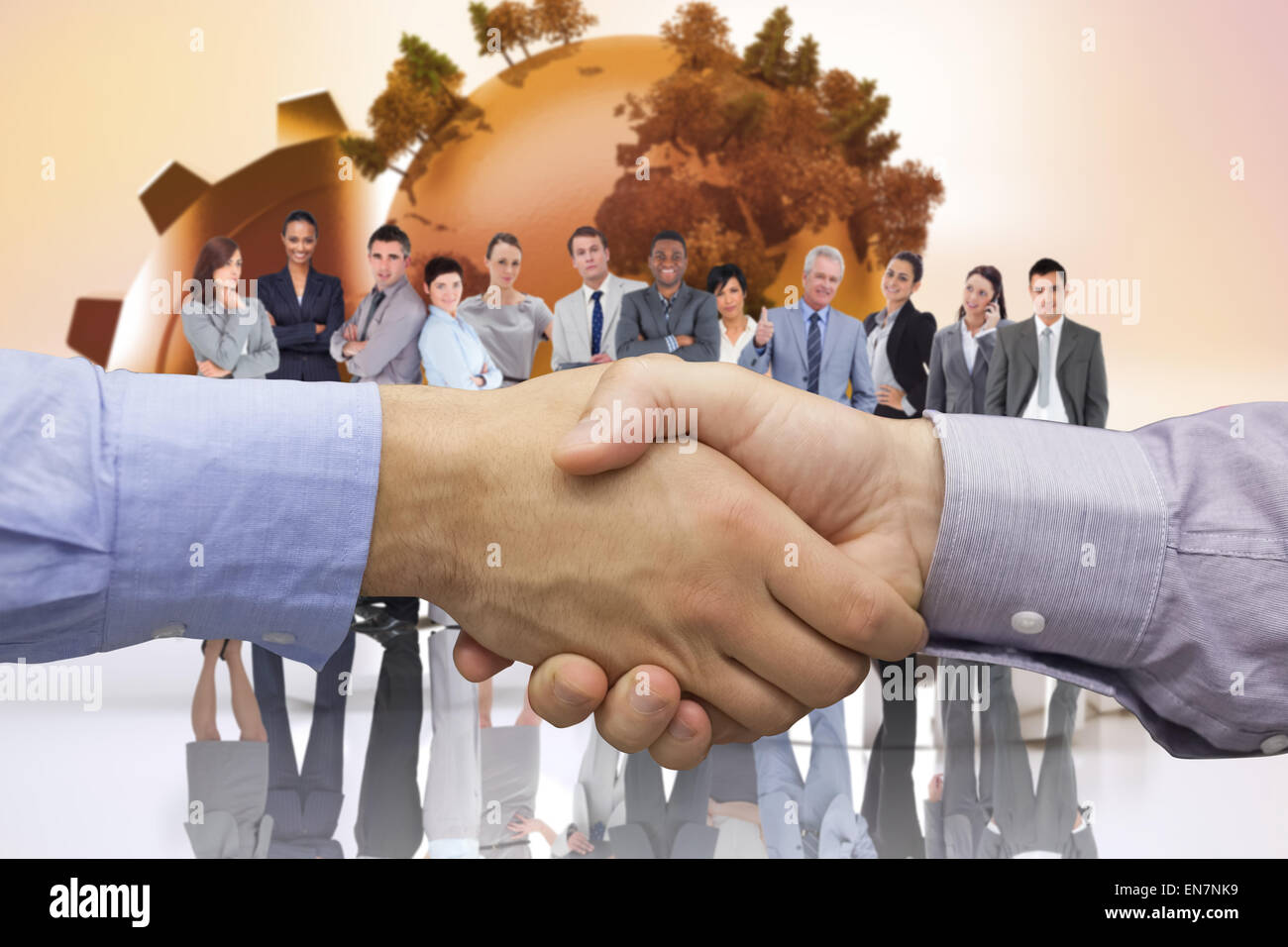 Composite image of hand shake in front of wires Stock Photo