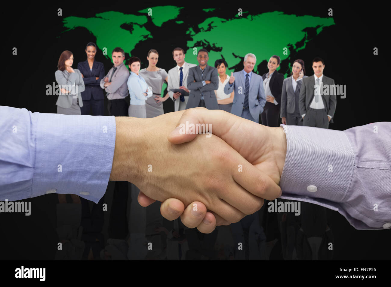 Composite image of hand shake in front of wires Stock Photo