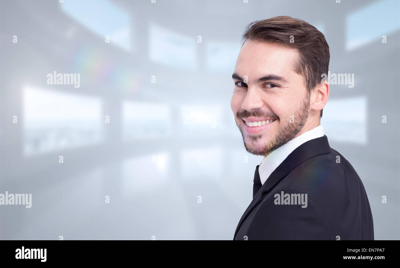 Composite image of elegant businessman in suit smiling at camera Stock ...