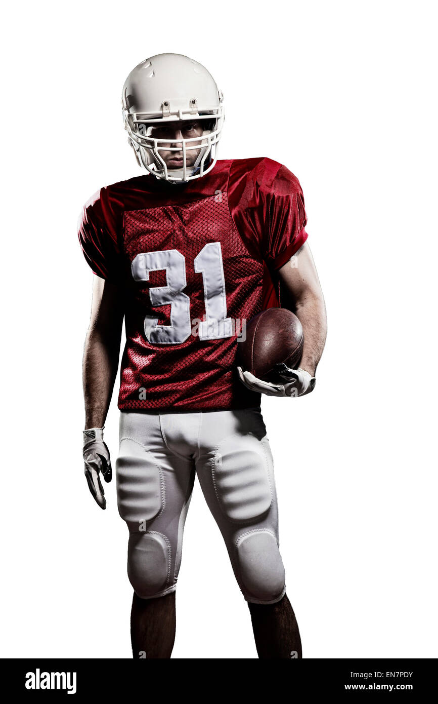 Football Player with a red uniform and a ball in the hand on a white background. Stock Photo
