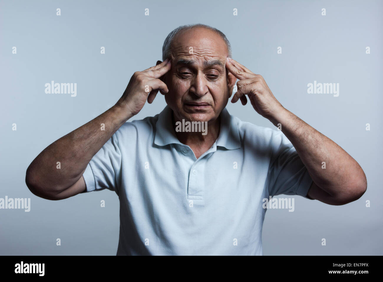 Old man with headache Stock Photo